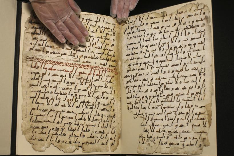 A fragment of a Quran manuscript is seen in the library at the University of Birmingham in England, 22 July 2015. Reuters.