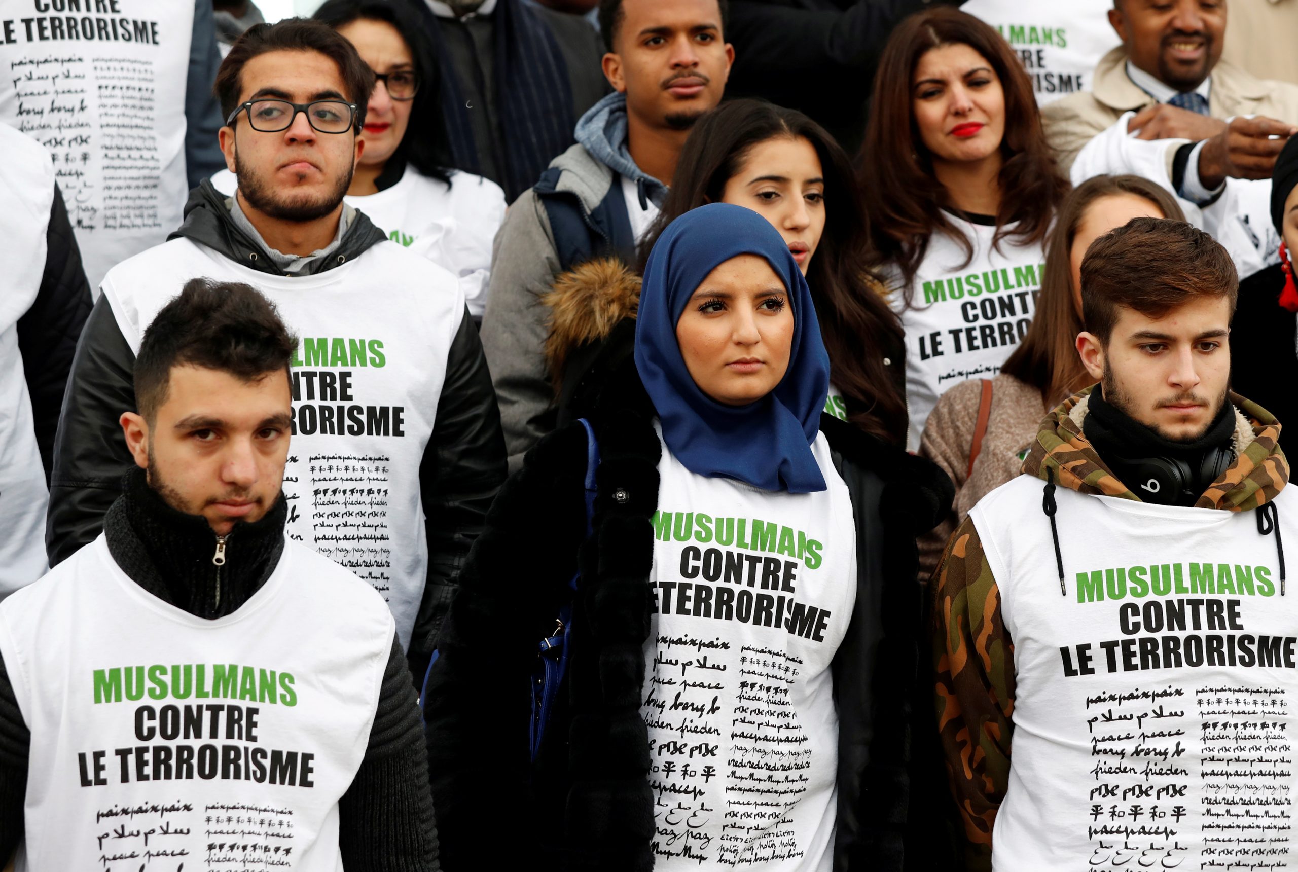 People wearing T-shirts that read ‘Muslims against Terrorism'’ as they gather at The Wall for Peace (Le Mur Pour La Paix), Paris, France, 13 November 2017. Reuters, Gonzalo Fuentes.