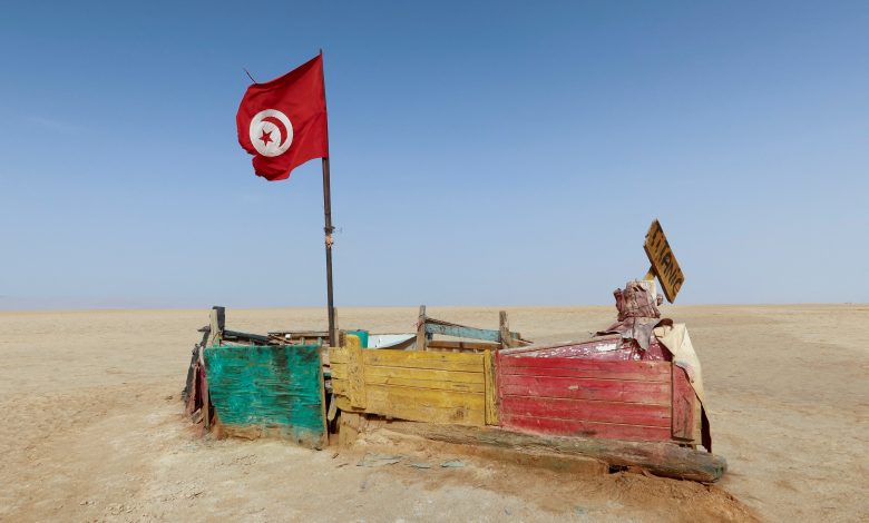A Tunisian flag flutters on a makeshift boat on the Salt Lake, southern Tunisia, 29 August 2022. Reuters, Jihed Abidellaoui.